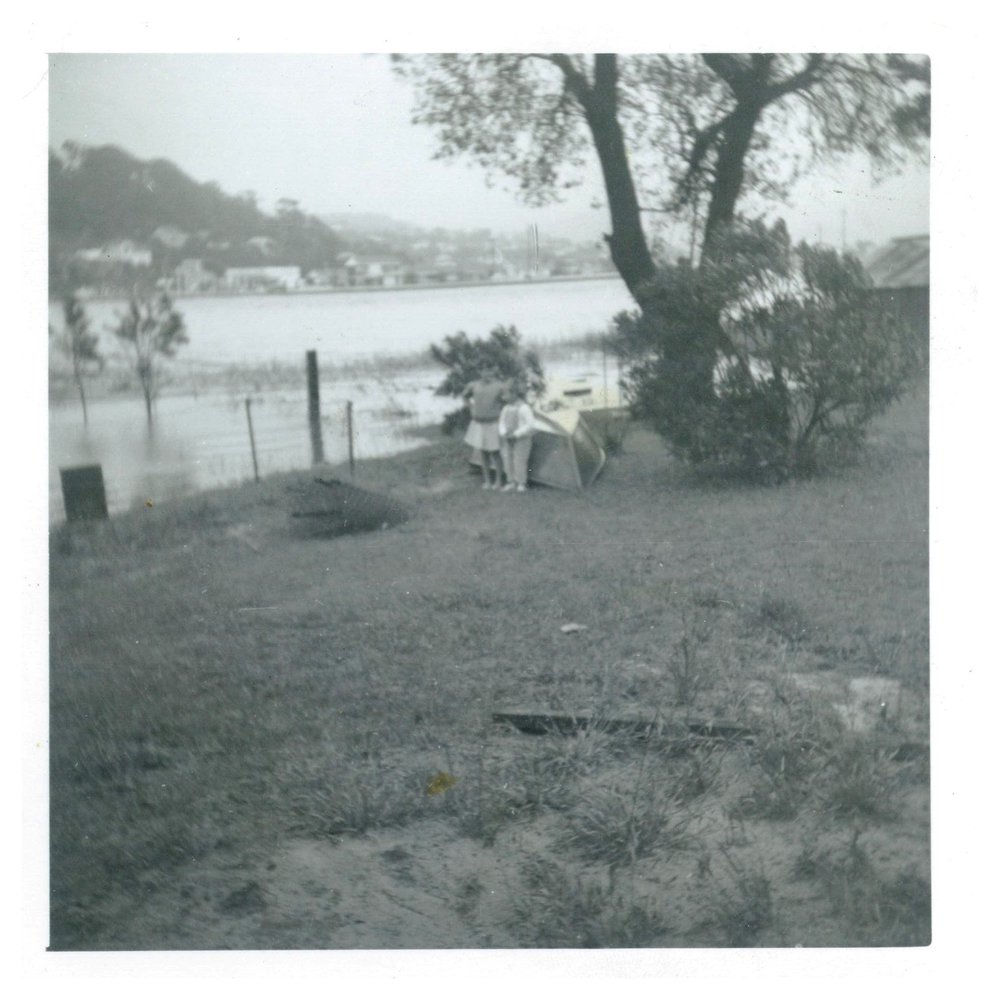 Children standing by Narrabeen Lagoon, 1959.