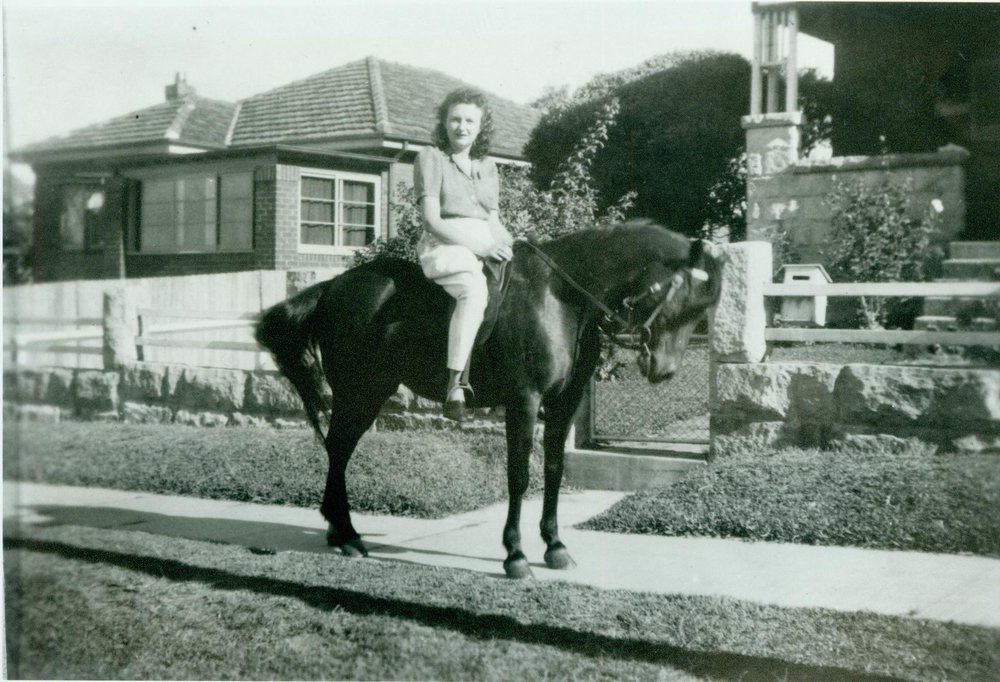 Olga Larkin on horse outside 20 Wetherill Street, Narrabeen