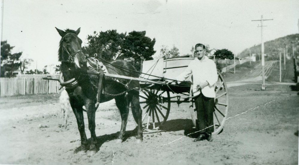 Bill Harrington, employee of Narrabeen Butchery, with horse and cart at Narrabeen