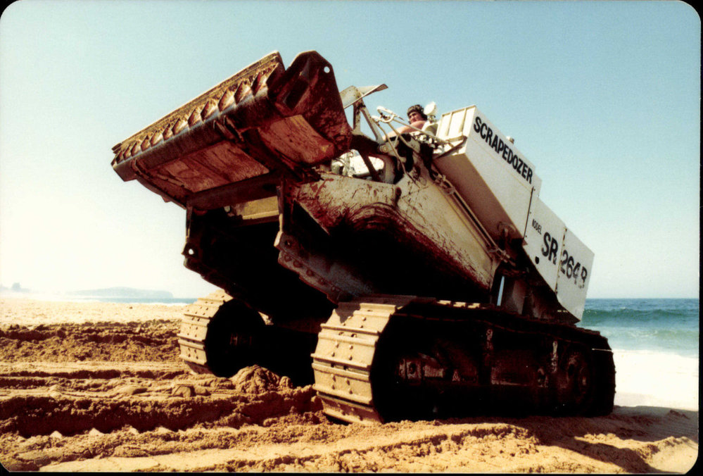 Scraper moving sand on Northern Beaches