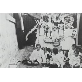 Children with a seated Santa at Christmas time, Bungan Beach, 1900s