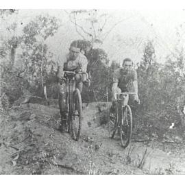 Bob (Robert) and Arthur Larkin riding bikes  on the Larkin farm at Ingleside