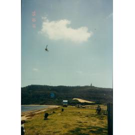 Helicopter delivering a water tank to Palm Beach, 1995