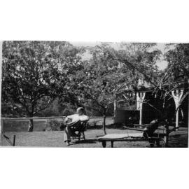 Mr Douglas sitting in yard of Mona Street house, Mona Vale 1947