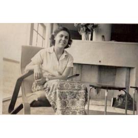 Ruth Fink sitting in chair inside of house at 153 Queens Parade East, Newport. 