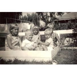 Baird children in their sand pit at 18 St Andrews Gate, Elanora Heights, 1965