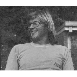 Surfer wearing tee shirt with the Peninsula Surf Club logo, Palm Beach, 1975