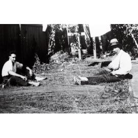 Laurence (Vince) Sly and Edward John Sly mending fishing nets