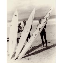 Three surfers with very fast Malibu surfboards, 1956