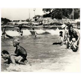 Unidentified people in the surf at South Steyne, Manly 1959