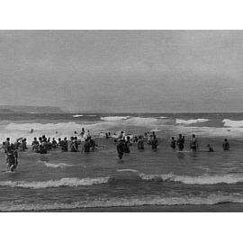 Swimmers in the water at Manly Beach