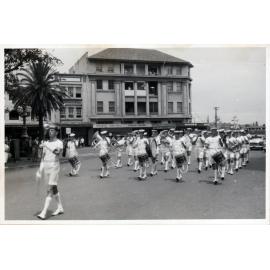 A procession moving along The Corso towards the beach, 1960