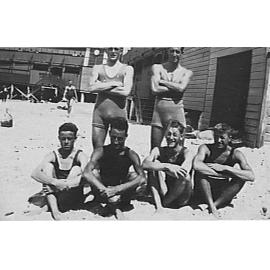Six members of Manly Surf Club with the surf pavilion in the