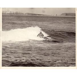 C.J. "Snowy" McAlister surfing at North Narrabeen, 1970s
