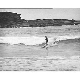 Man riding a surfboard, Freshwater Beach