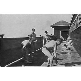 Unidentified boys playing at surf pavilion