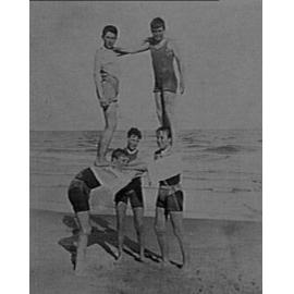 Unidentified boys forming human pyramid, Manly Beach