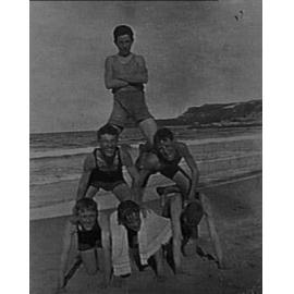 Unidentified boys forming human pyramid, Manly Beach