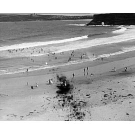 People swimming and walking at Freshwater Beach