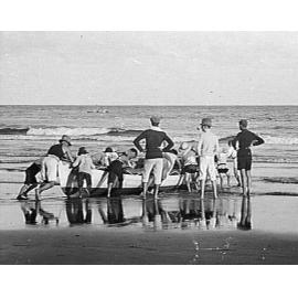 Launching a rowboat at Freshwater Beach