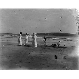 Ladies with children playing at a beach