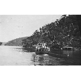 Part of Cowan Creek and district showing houseboats and large boat