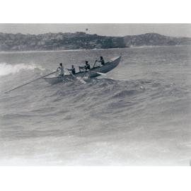 Surf boat in action at Manly Beach