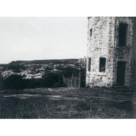 Stone tower in front of Dalley's Castle, with view over Manly
