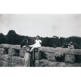 Wynn Harwood and daughter Lorraine sitting on stone fence, Seaforth