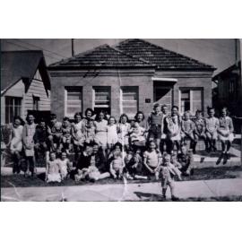Group of children and mothers in front of 18 Johnson Street, Harbord