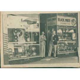 A.V. Robinson's tobacco shop in The Corso, with two people standing at the door