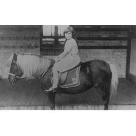 Dorothy Miles in in front of a weathershed in Brookvale