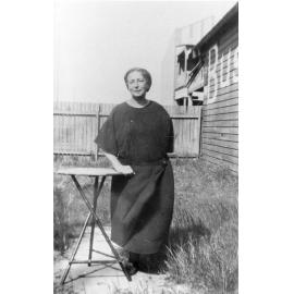 Mrs Langford outside the general store in Brookvale