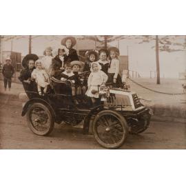 Group portrait of youths aboard a vintage motor vehicle, Manly Beach, 1908