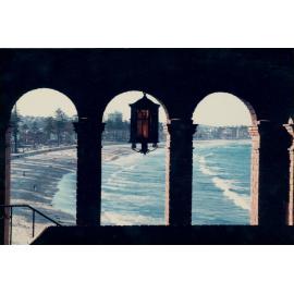 View north along Manly Beach, from the arch entry of the 1930 Borambil apartments, 1976