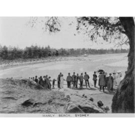 Crowds gathered overlooking Manly Beach, viewed from Fairy Bower Walkway, c1920s