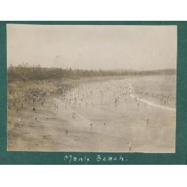 View facing north, showing large crowds gathered on Manly Beach, c1920s