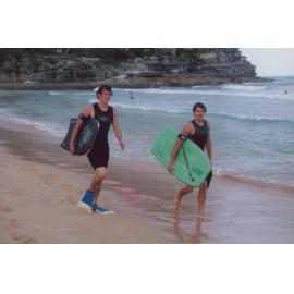 Two bodyboarders on Queenscliff Beach, with the pool and surf in background, 2005