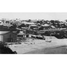 View facing east over Little Manly Cove, showing a boatshed and houses covering the hillside