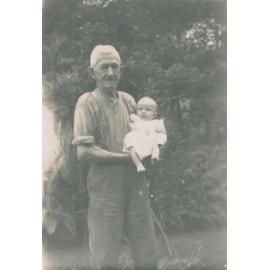 James Ireland holding his grandson, Fairlight.