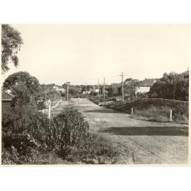 Armstrong Street prior to sealing, Seaforth, 1956