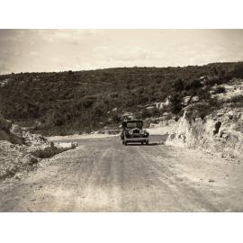 Car in Ernest Street at junction of Condamine Street with rocky siding, Balgowlah, 5th September 1935