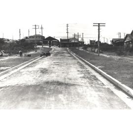 Man reviewing verge on Dudley Street near Sydney Road, Seaforth, 26th January 1939