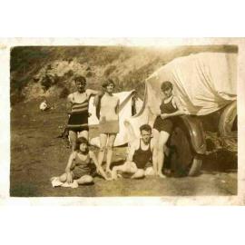 Nancy Wooldridge standing in centre, Walter Carpenter sitting at right at Newport Beach