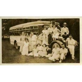Bus picnic, Nancy Wooldridge and Walter Carpenter sitting at front wheel