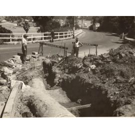 Earthworks continue with placement of a 30-inch pipe at Battle Boulevarde, Seaforth, October 1948