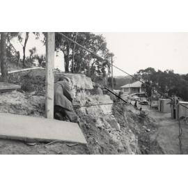 Peronne Avenue construction works contnue, man on hillside, Clontarf, 1956