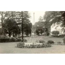 Rotary fountain in Gilbert Park, with women walking through the green, Manly, 1963
