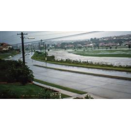 Pittwater Road, North Manly looking south showing Brookvale Creek in flood at Warringah Golf Course, 1961