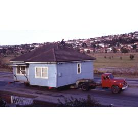 A house being transported northwards on Pittwater Road, 1970